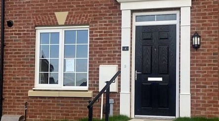 Entrance to Beauty Couture & Aesthetic Salon, Leicester, England, GB showcasing elegant brick facade.