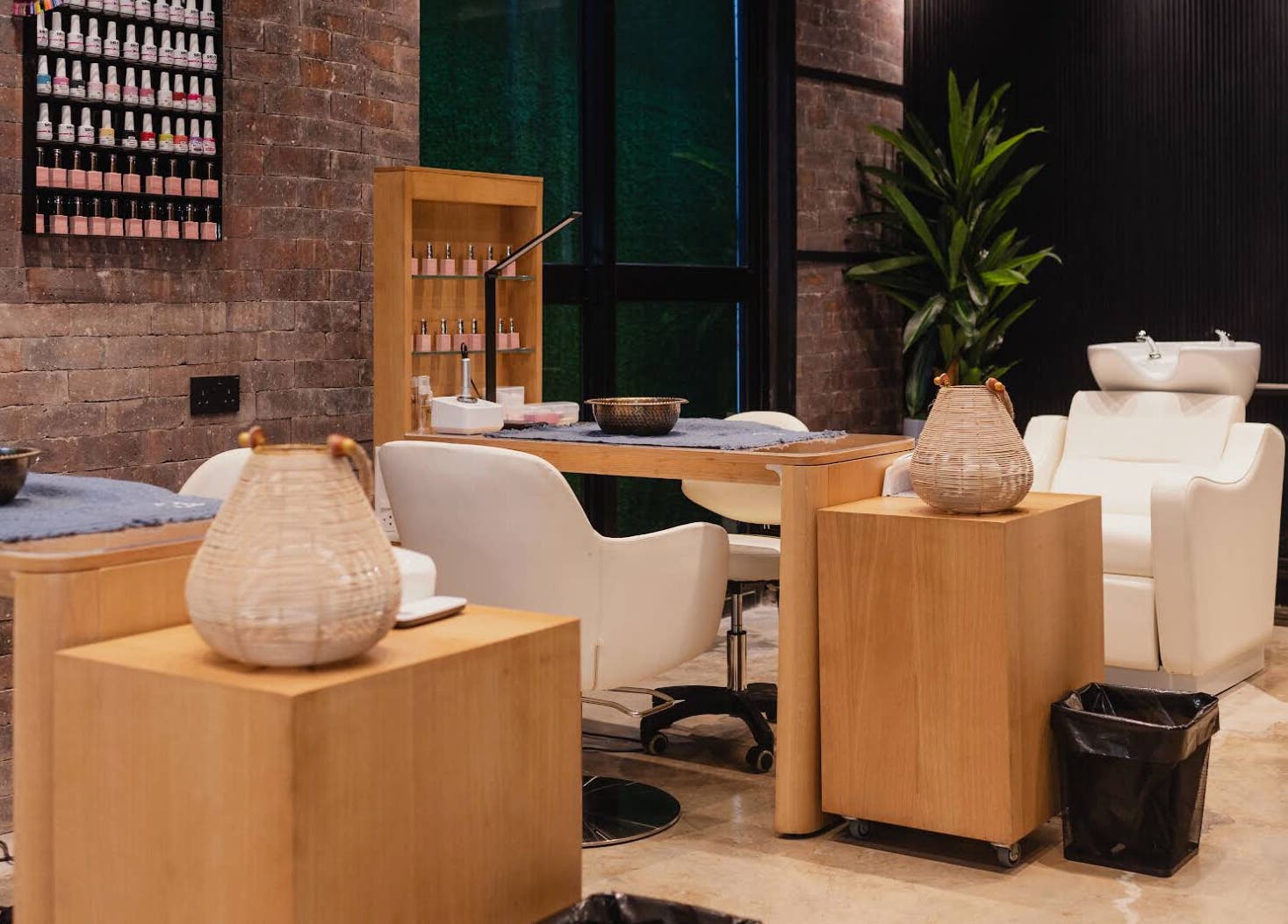 Elegant nail salon at The Spa at Cargo 88 in Lusaka, Lusaka Province, ZM with plush chairs and well-lit decor.