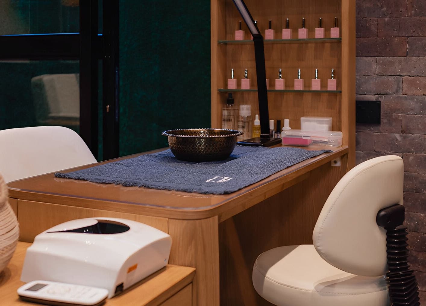 Manicure station at The Spa at Cargo 88, Lusaka, Lusaka Province, ZM, featuring plush chairs and nail products.