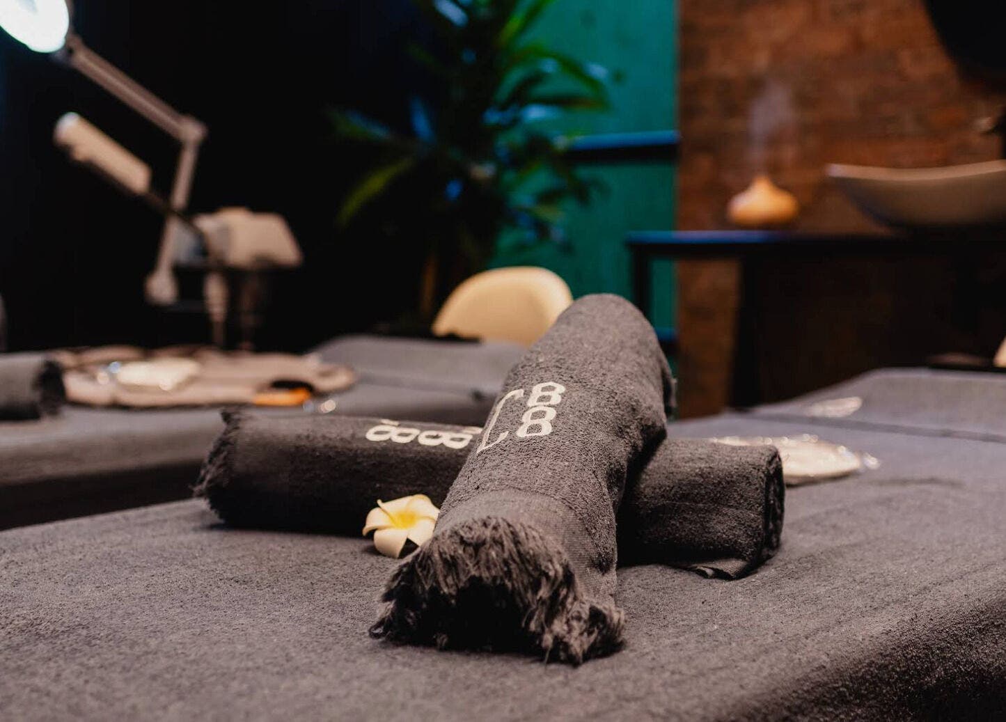 Luxurious massage table setup at The Spa at Cargo 88, Lusaka, Lusaka Province, ZM, showcasing a tranquil ambiance.