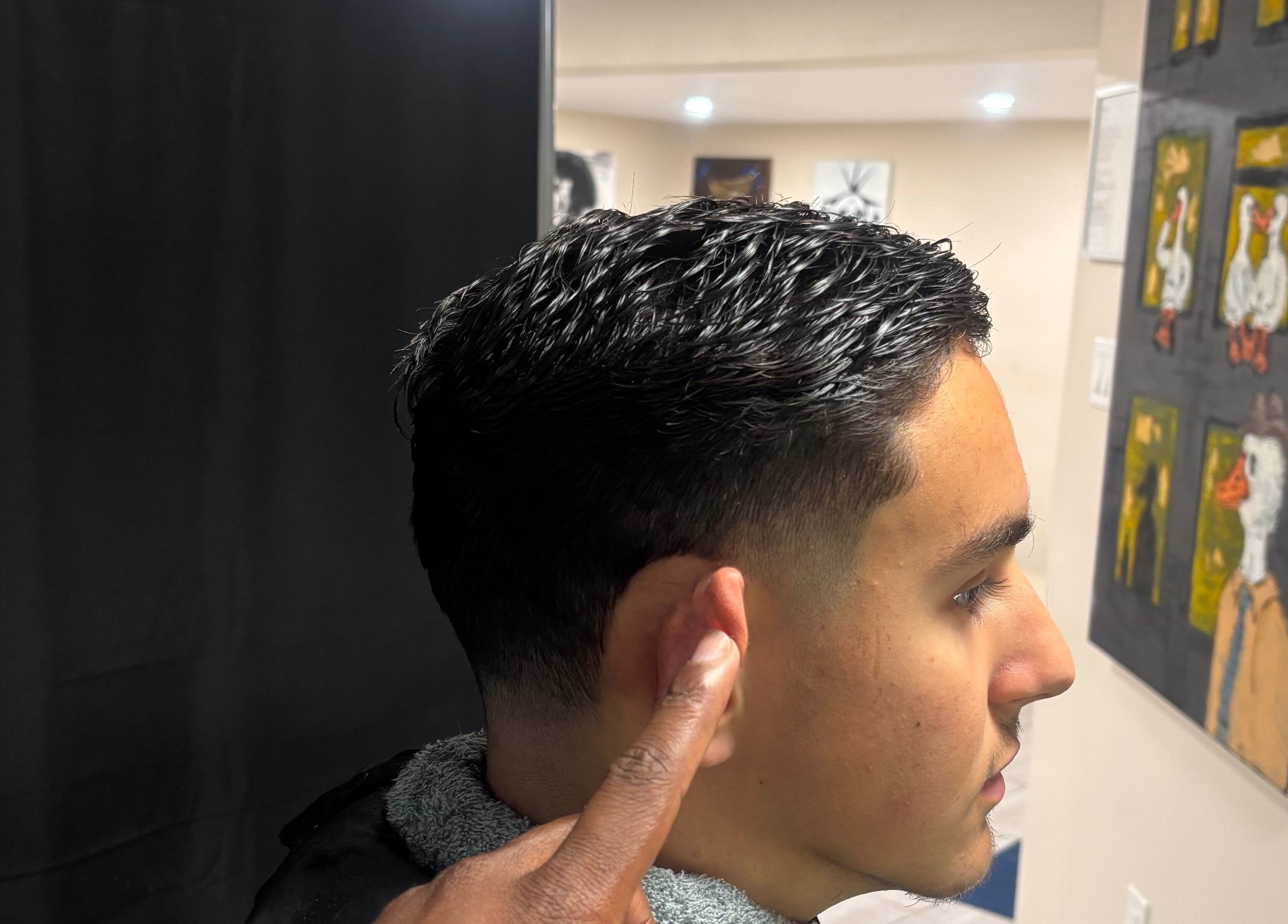 Detailed side view of a sleek haircut at Picutsso The Barber, Charlottetown, Prince Edward Island, CA.