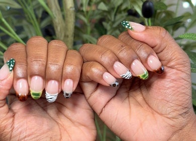 Stylish nature-themed nail art at Barepolish, Sterling, Virginia, US, featuring vibrant green and zebra patterns.
