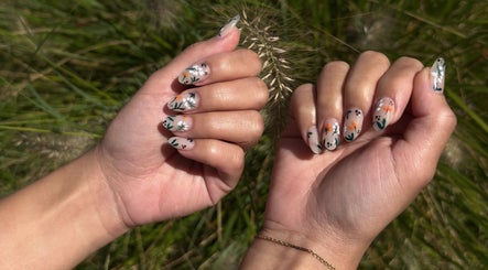 Floral nail art at Barepolish, Sterling, Virginia, US, showcasing intricate design on manicured hands.