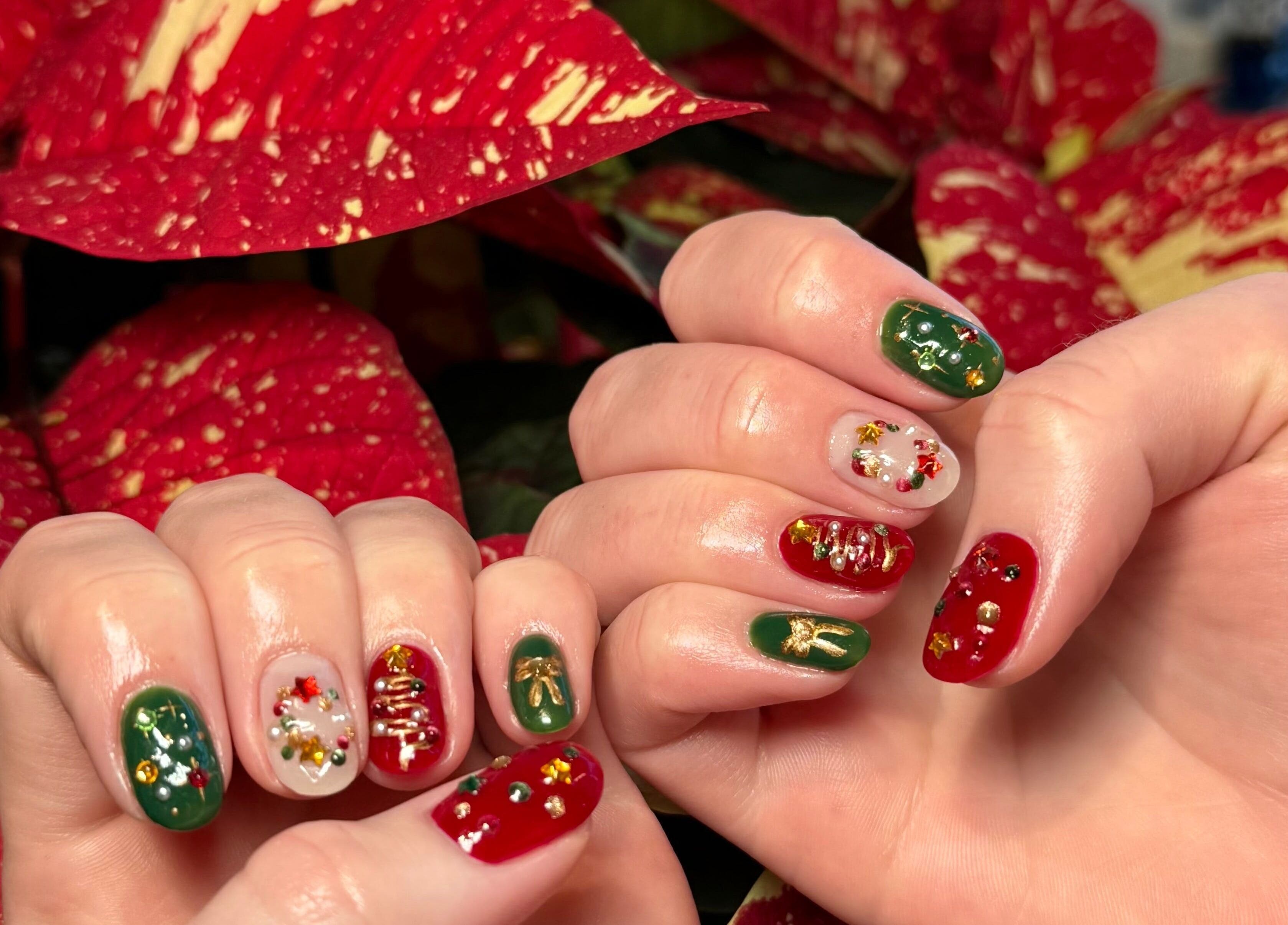Holiday-themed nail art at Barepolish in Sterling, Virginia, US featuring red and green designs.