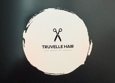 Truvelle Hair salon logo featuring scissors, located in Edensor Park, New South Wales, AU.