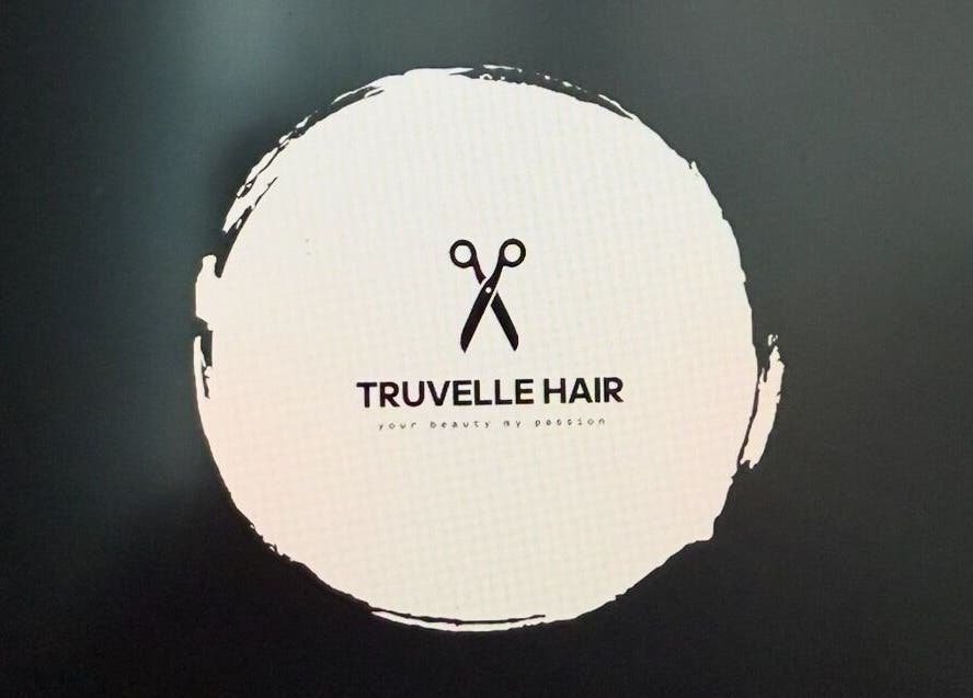 Truvelle Hair salon logo featuring scissors, located in Edensor Park, New South Wales, AU.