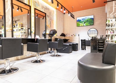 Modern interior of Project Hair Salon in Port Adelaide, South Australia, AU with stylish black chairs.
