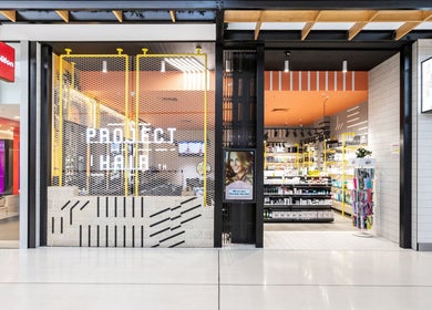 Entrance of Project Hair Salon in Port Adelaide, South Australia featuring modern design and open interior.