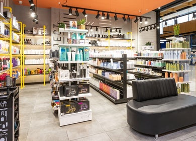Interior of Project Hair Salon, Port Adelaide, showcasing diverse hair care products and modern decor.