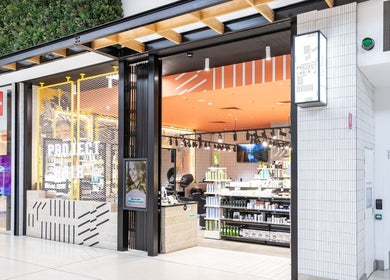 Entrance of Project Hair Salon in Port Adelaide, South Australia, AU, showing a stylish, inviting interior.