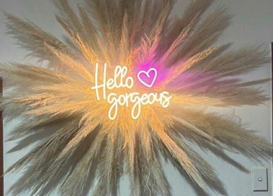 Neon sign 'Hello gorgeous' at The Lady Cave, Palmerston North, Manawatū-whanganui Region, NZ.
