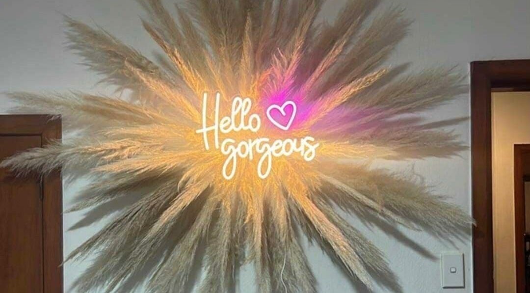 Neon sign 'Hello gorgeous' at The Lady Cave, Palmerston North, Manawatū-whanganui Region, NZ.