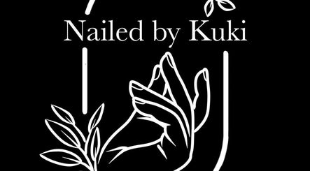 Artistic depiction of hands and leaves at Nailed by Kuki, Willemstad, CW.