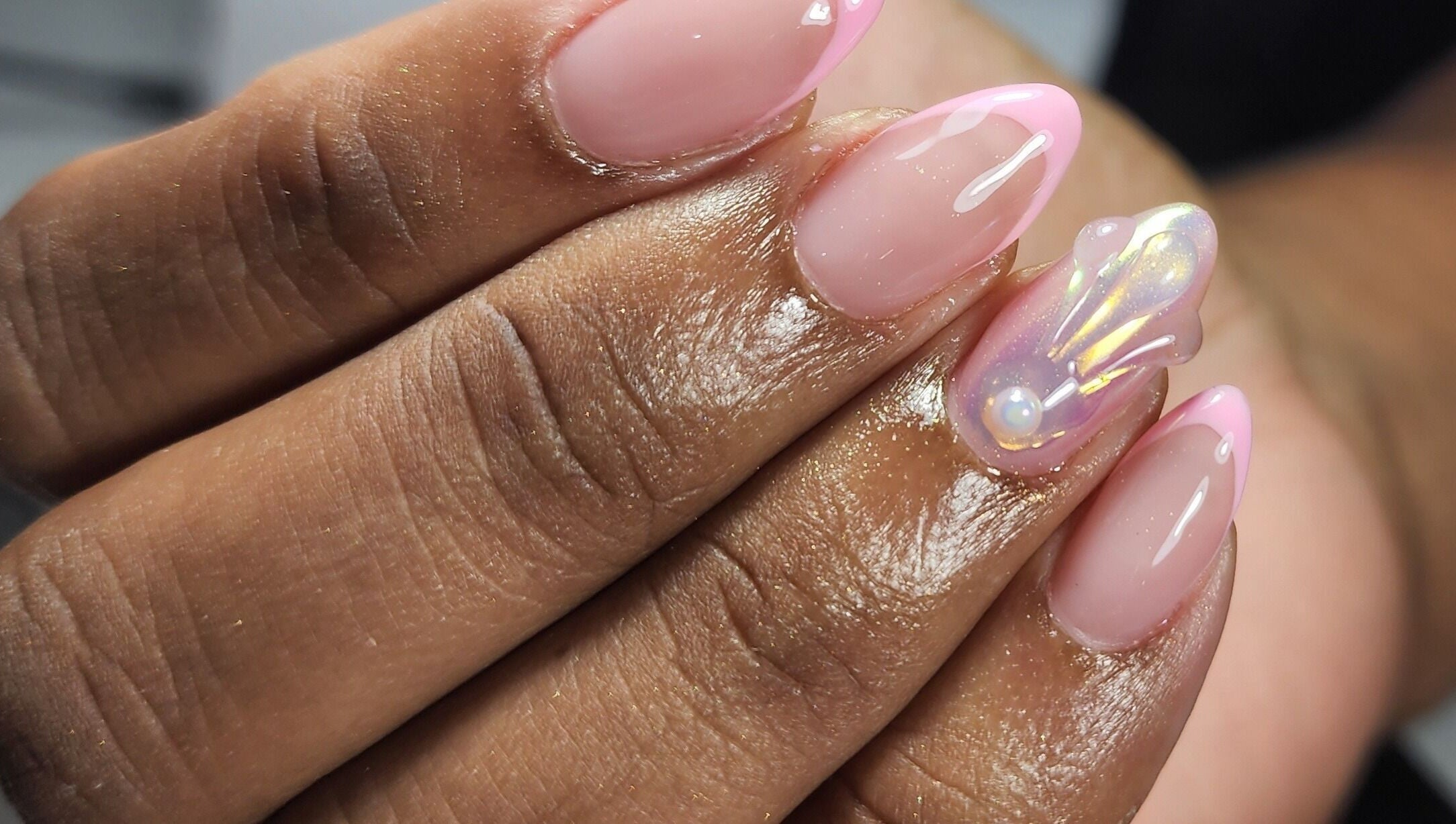 Beautiful iridescent nail art with pearl accent at Nailed by Kuki, Willemstad, CW.