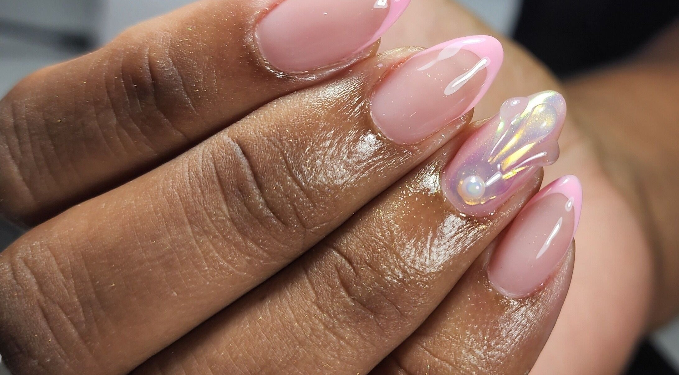 Beautiful iridescent nail art with pearl accent at Nailed by Kuki, Willemstad, CW.