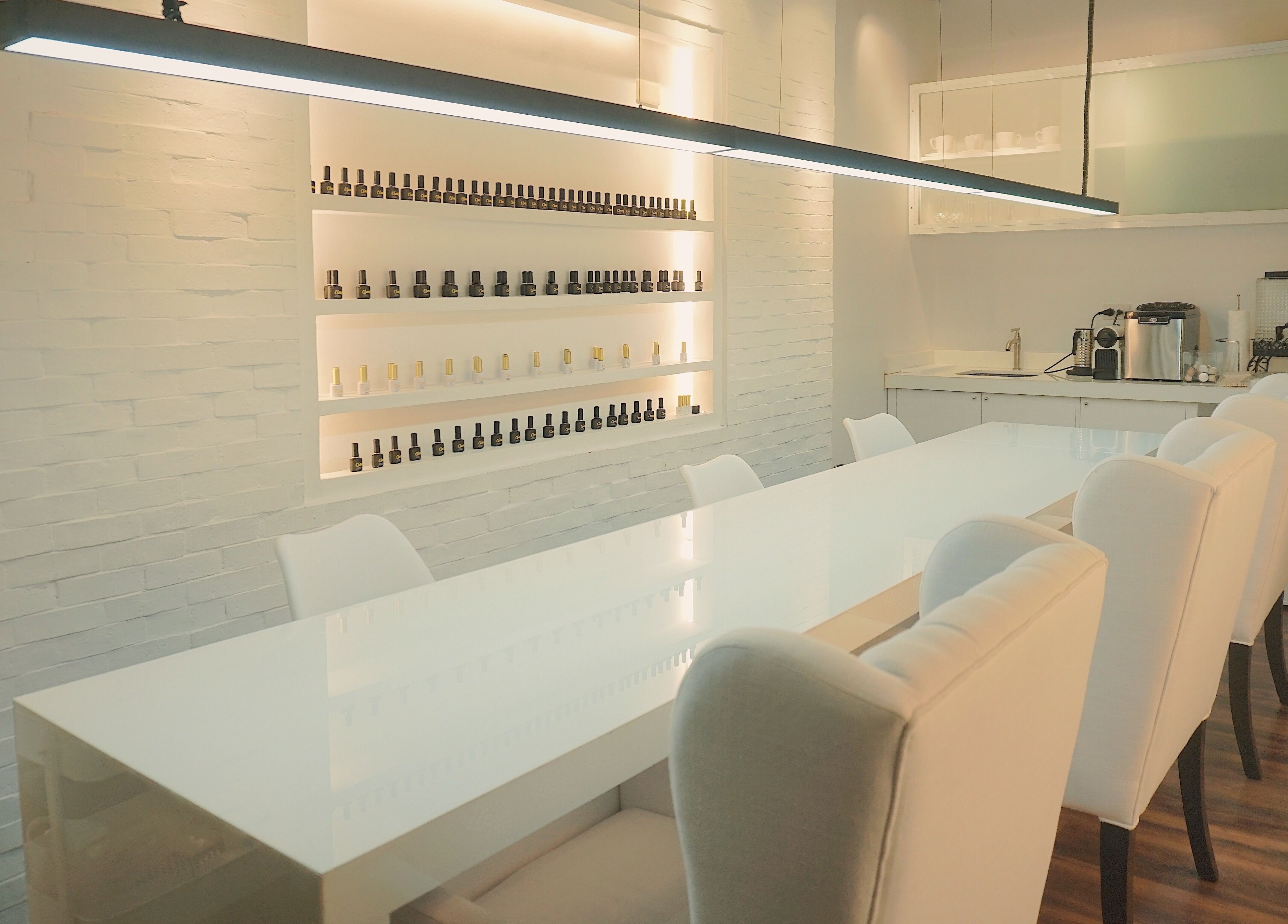 Spacious interior of Claws Studio in Mandaluyong City, Metro Manila, PH with sleek nail polish displays.