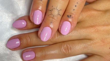 Elegant lavender nails by Leticia Jameli in Mermaid Beach, Queensland, AU with delicate finger tattoos.