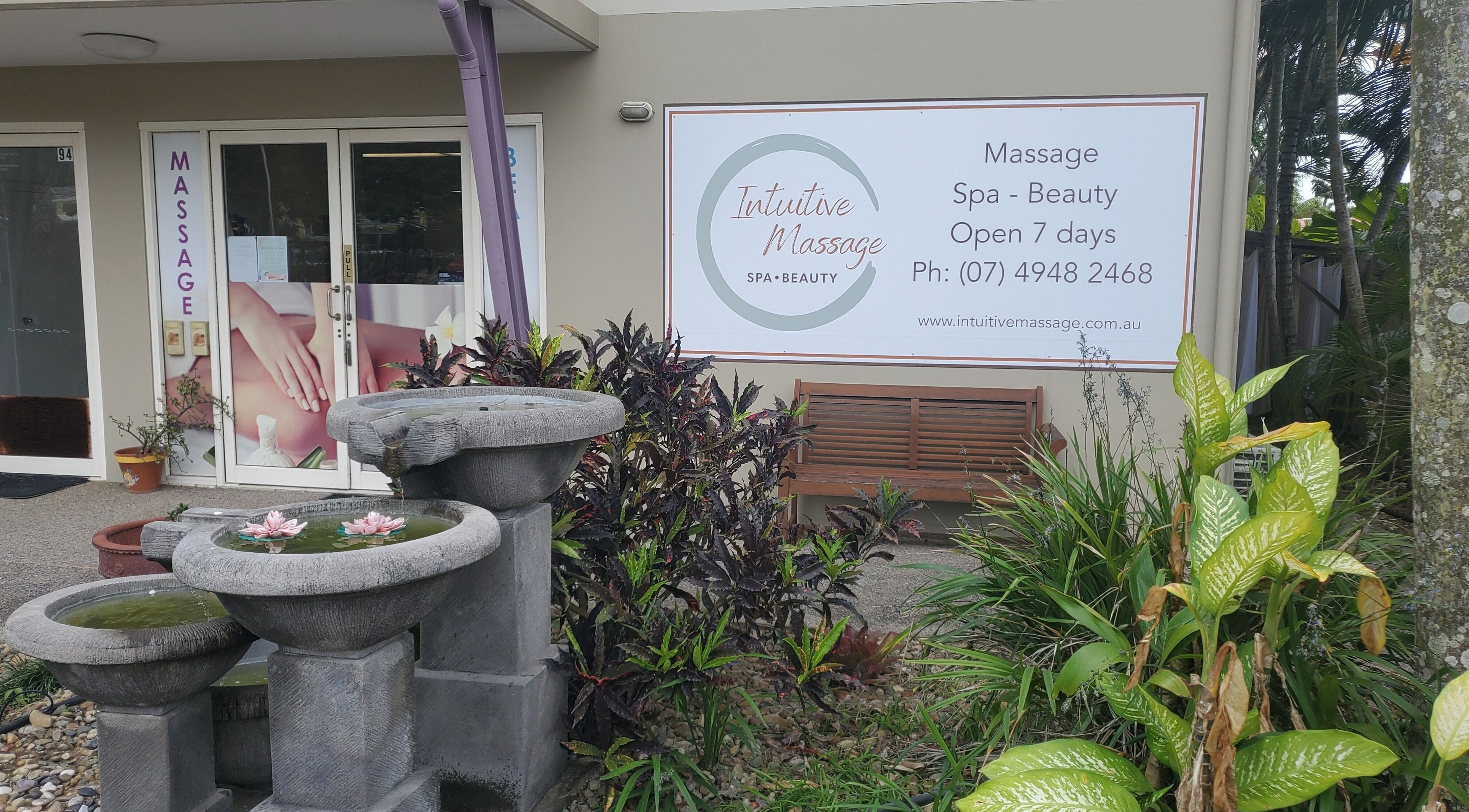Entrance of Intuitive Massage Spa Beauty in Cannonvale, Queensland, AU with calming water feature.