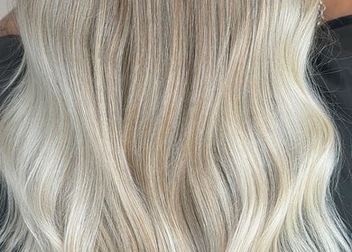 Blonde hair styled at Paigelouisehair, Derby, England, GB. Sleek and smooth finish.