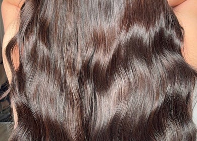 Smooth, shiny brown hair at Paigelouisehair, Derby, England, GB, showcasing expert styling.
