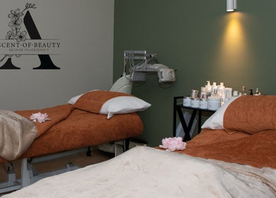Relaxing spa room at A Scent of Beauty, Woodcroft, South Australia, AU with cozy massage tables and soft lighting.
