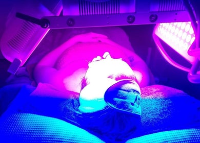 Person enjoying LED light therapy at A Scent of Beauty, Woodcroft, South Australia, AU.