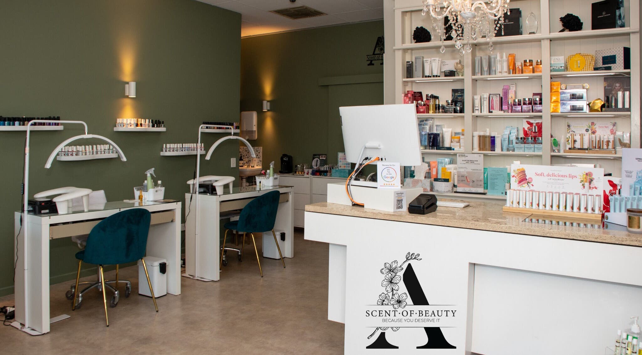 Interior of A Scent of Beauty in Woodcroft, South Australia, showcasing manicure stations and product shelves.