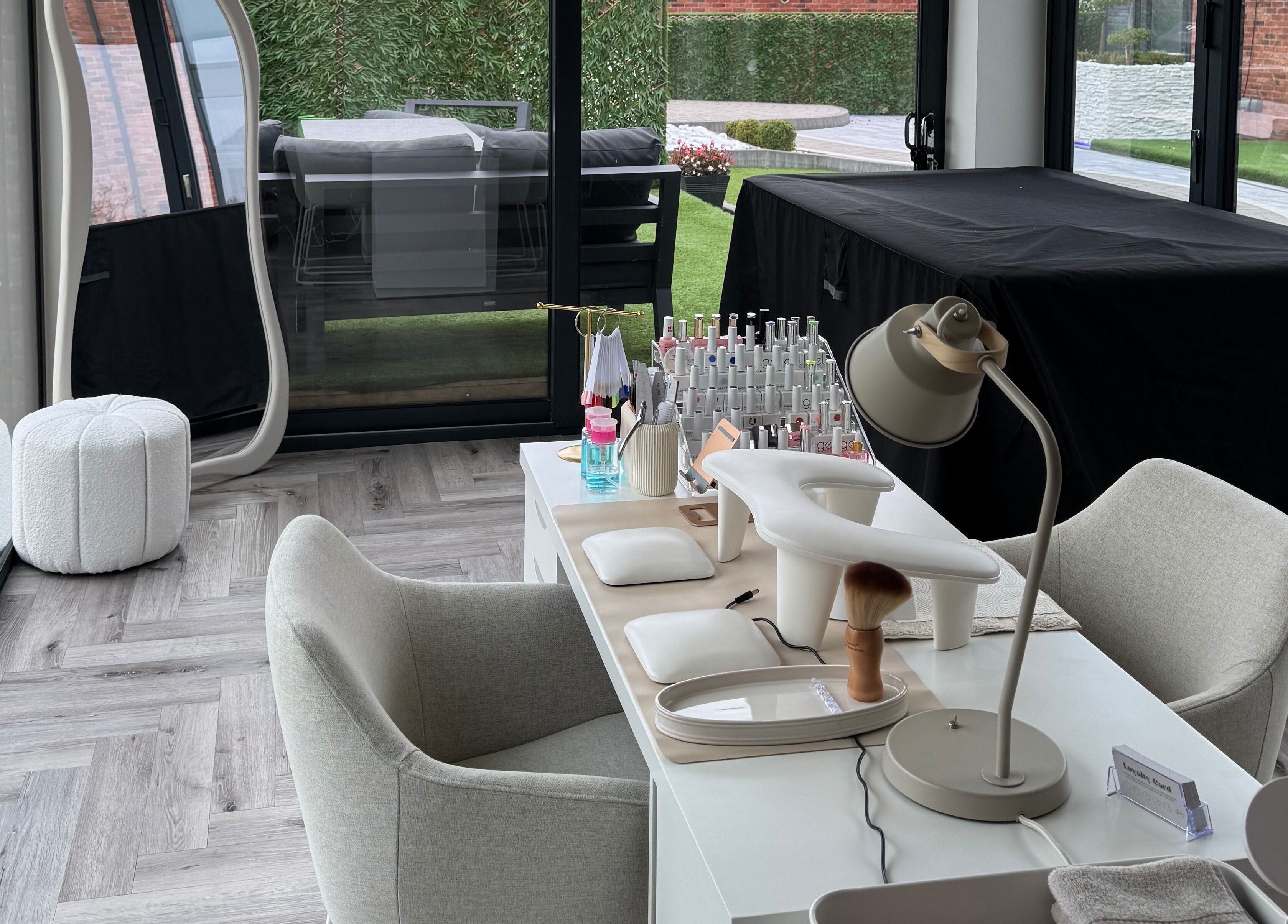 Modern nail station at Polished By Poppy, Unsworth, England, GB, featuring elegant decor and organized tools.