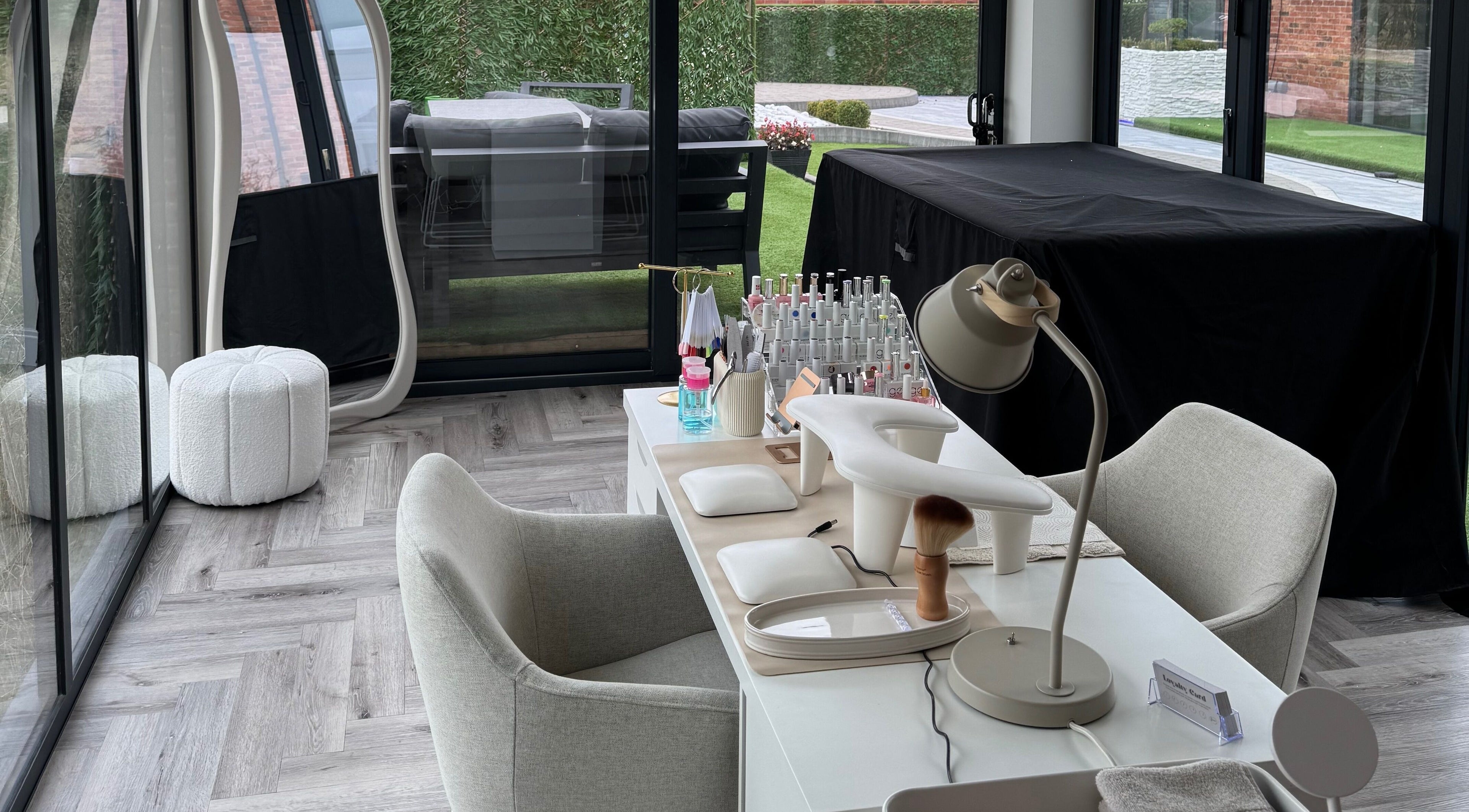 Modern nail station at Polished By Poppy, Unsworth, England, GB, featuring elegant decor and organized tools.