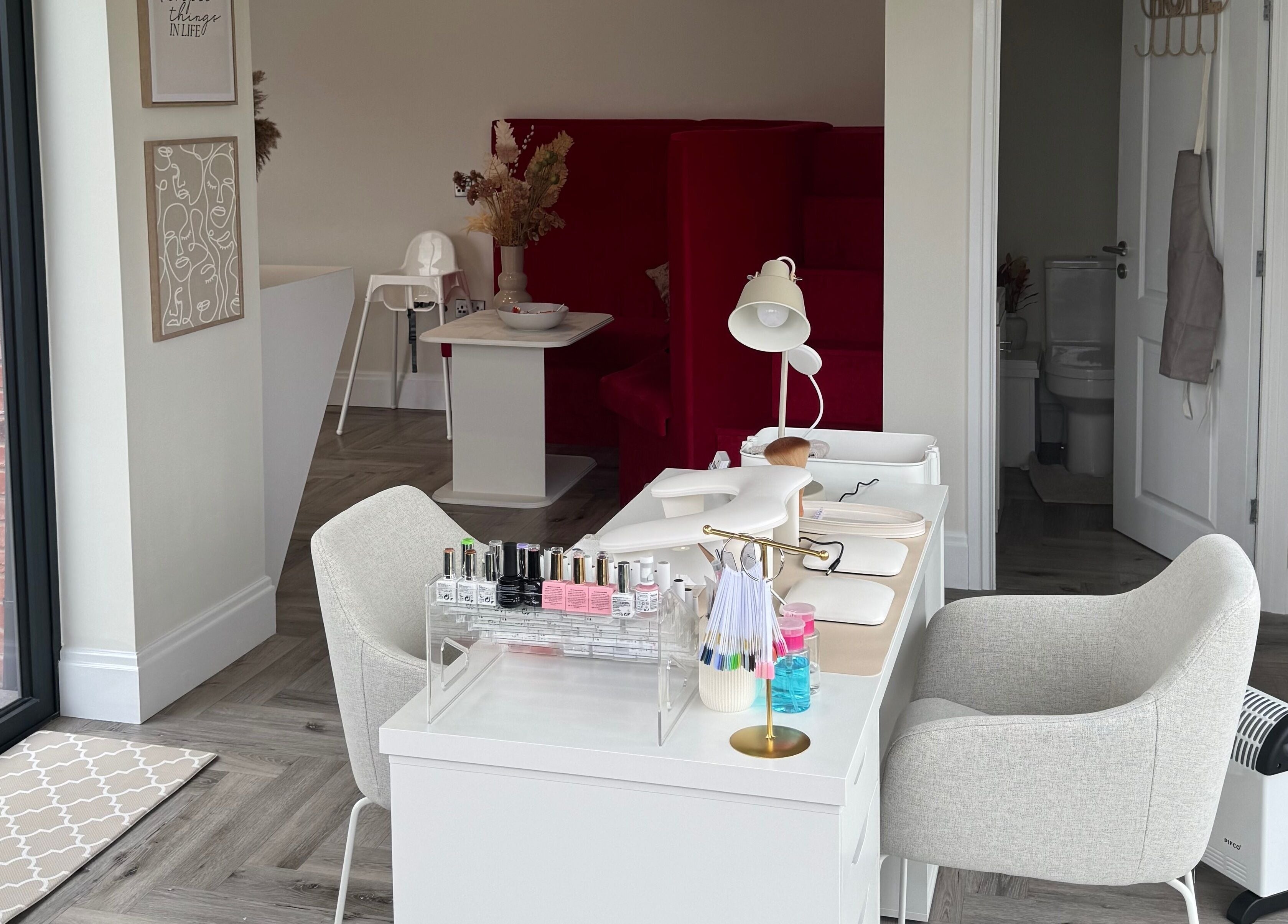 Modern nail salon setup at Polished By Poppy, Unsworth, England, GB, with elegant decor and spa chairs.