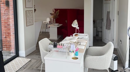 Modern nail salon setup at Polished By Poppy, Unsworth, England, GB, with elegant decor and spa chairs.