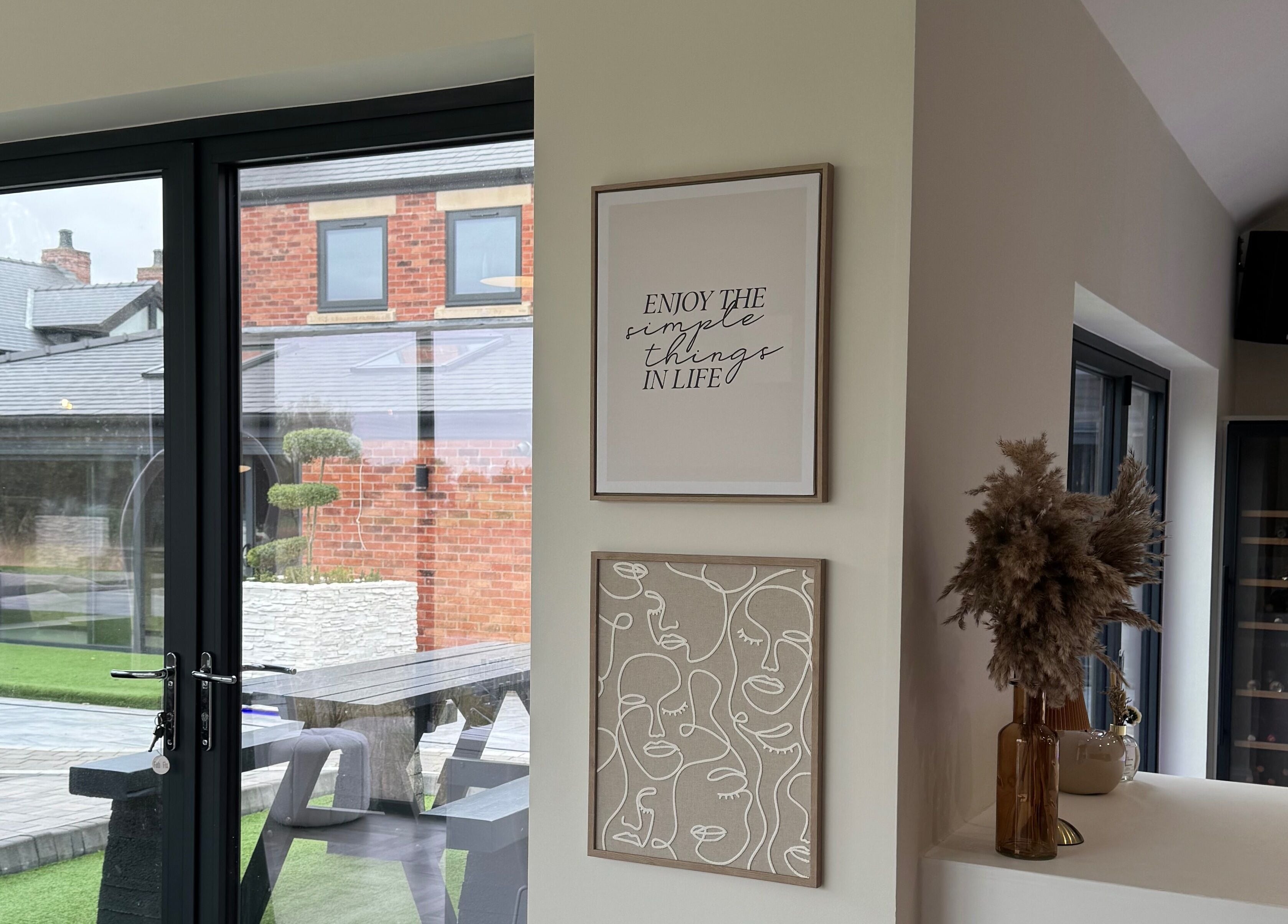 Modern interior at Polished By Poppy, Unsworth, England with chic decor and ample natural light.