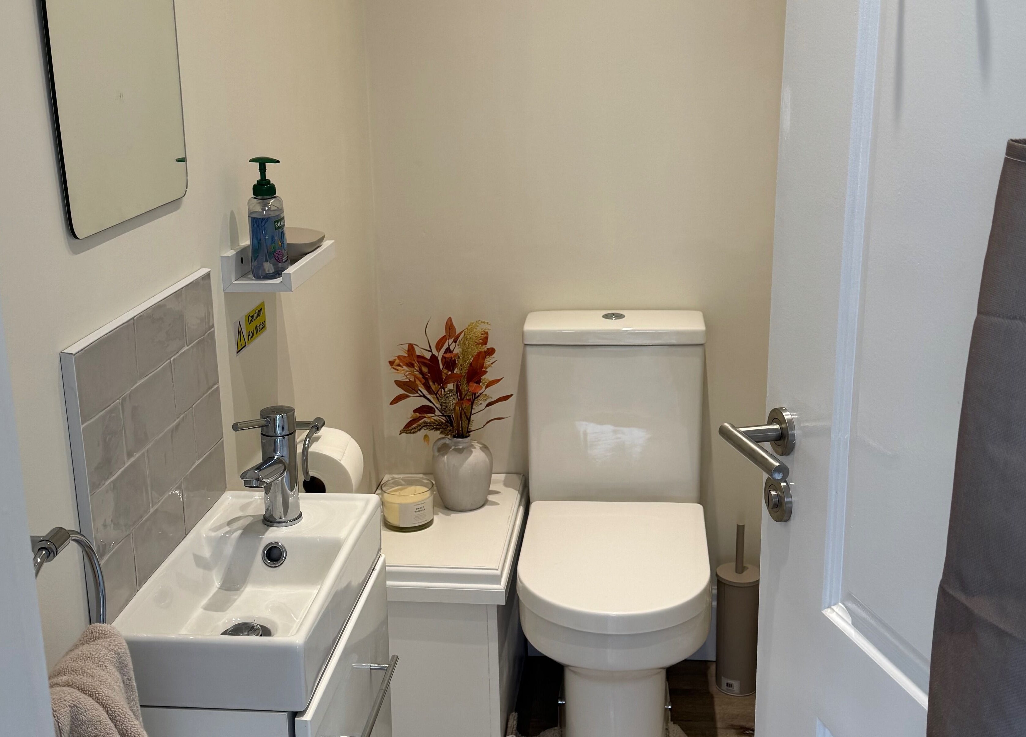 Restroom at Polished By Poppy, Unsworth, England, GB featuring modern amenities and tasteful decor.