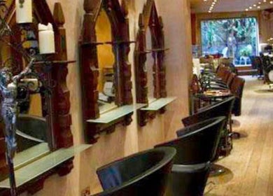 Inside view of Jenelle Thompson hair @ Giovanni’s, a chic salon in London, England, GB with stylish decor and seating.