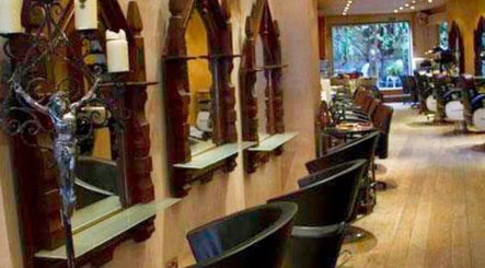Inside view of Jenelle Thompson hair @ Giovanni’s, a chic salon in London, England, GB with stylish decor and seating.