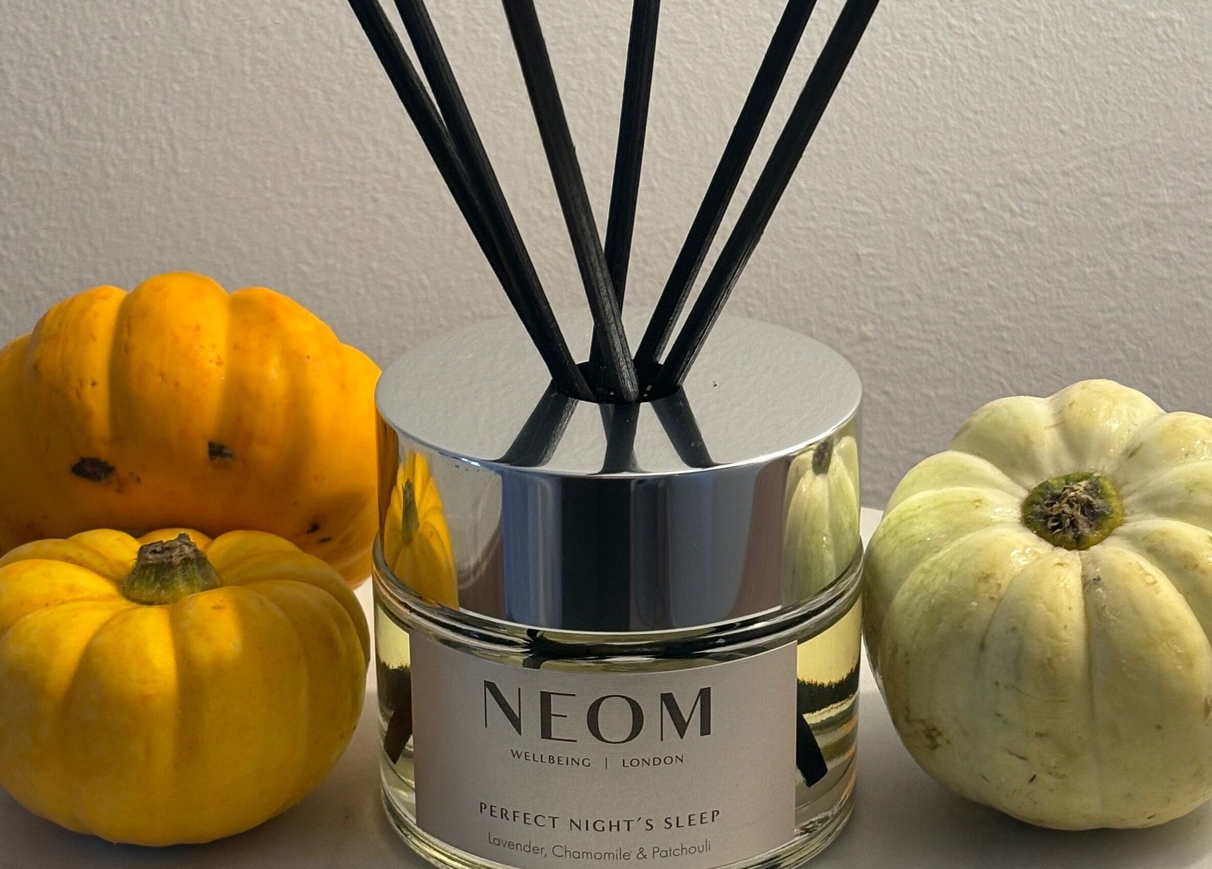 Netherfield Retreat in Castleford, England, GB displays Neom diffuser with small pumpkins, enhancing relaxation.