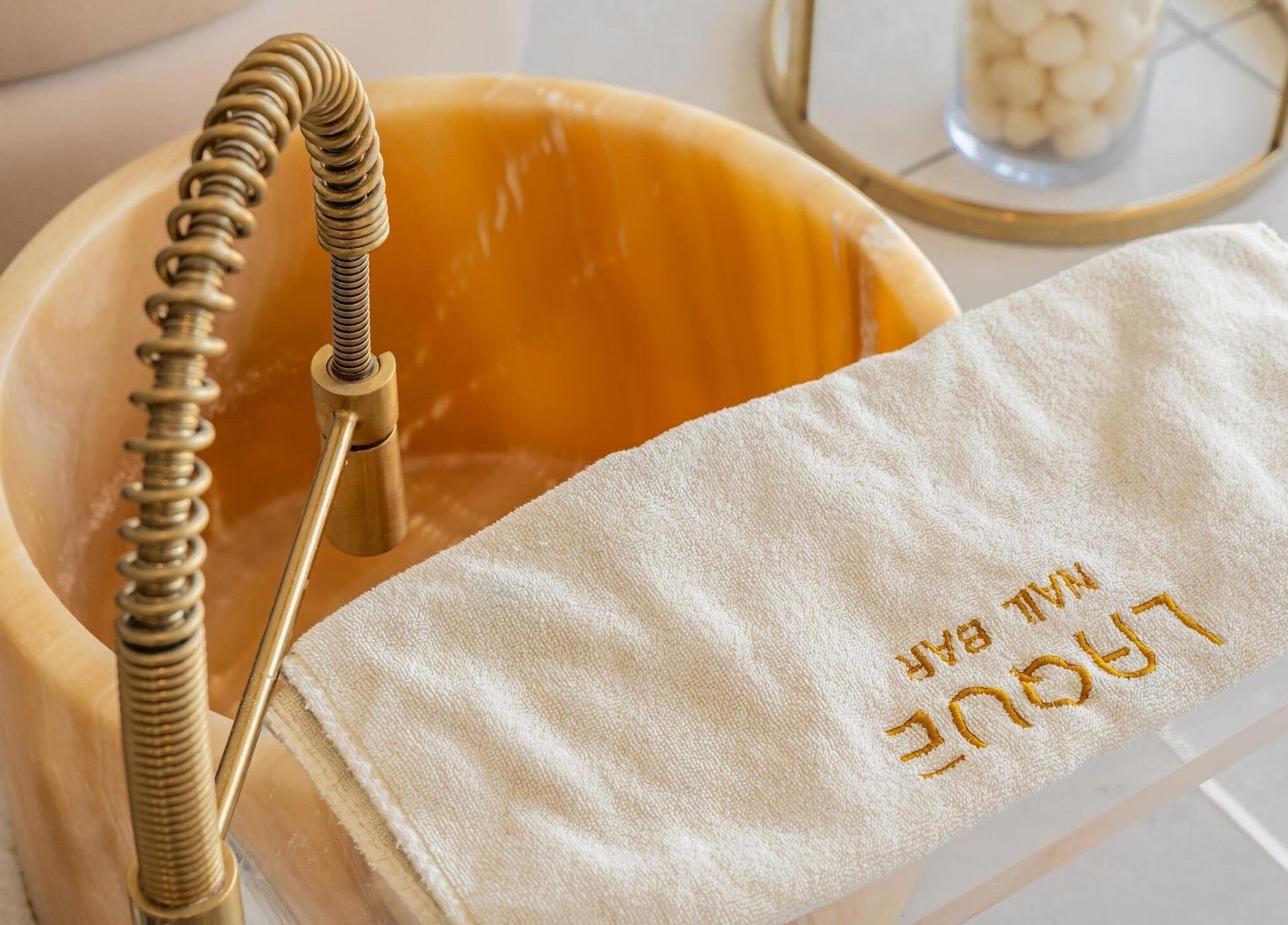 Luxurious pedicure bowl at Laque Collective Ladies Salon in Dubai, Dubai, AE offering a relaxing spa experience.