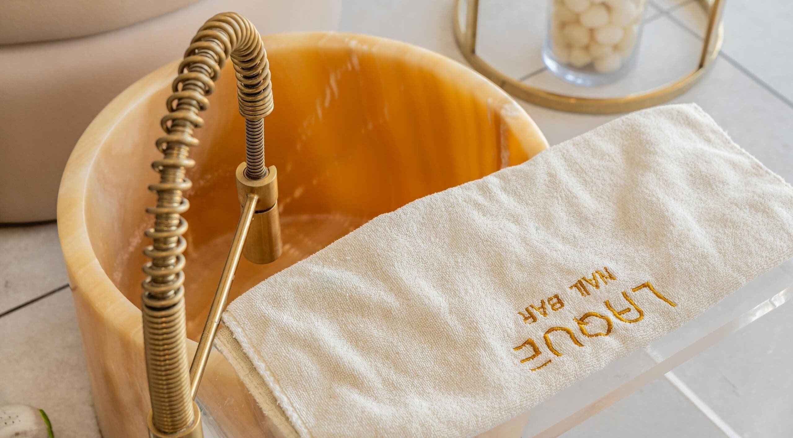 Luxurious pedicure bowl at Laque Collective Ladies Salon in Dubai, Dubai, AE offering a relaxing spa experience.