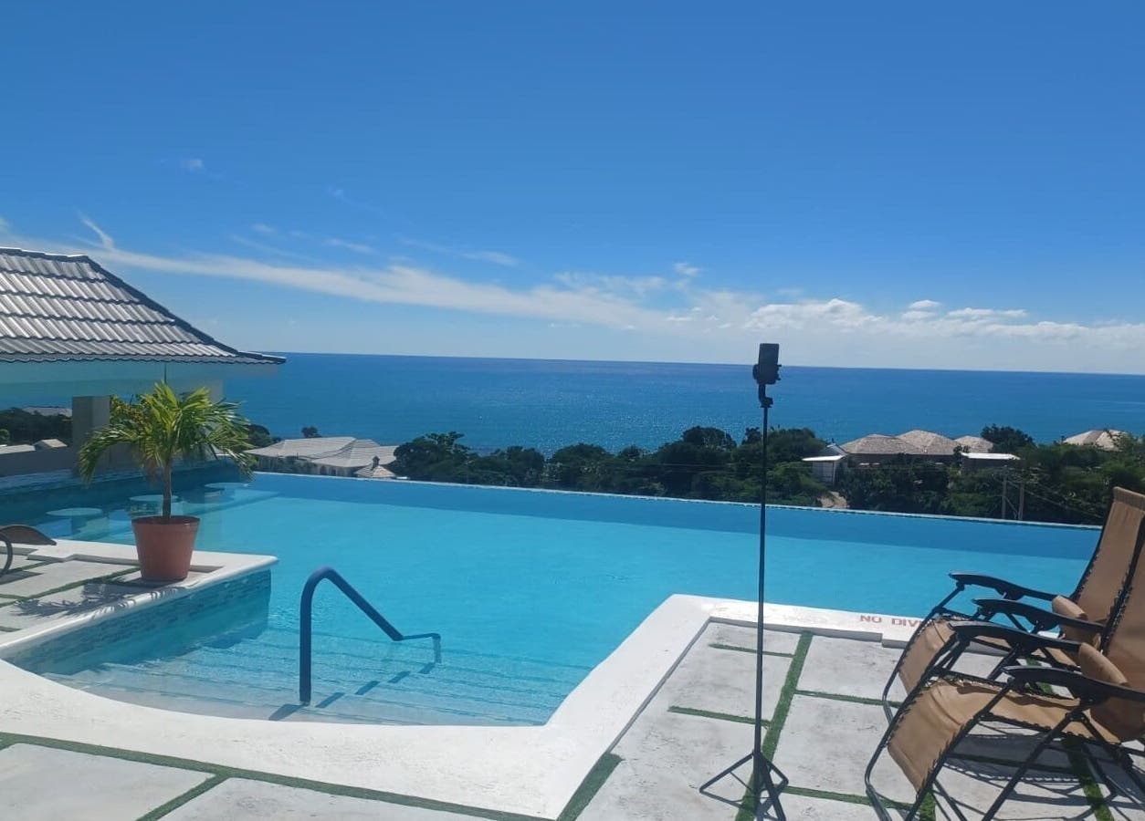 Rooftop infinity pool overlooking sea at Tranquil Travels Mobile Spa, Ocho Rios, JM.