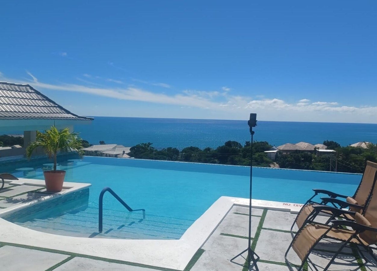 Rooftop infinity pool overlooking sea at Tranquil Travels Mobile Spa, Ocho Rios, JM.