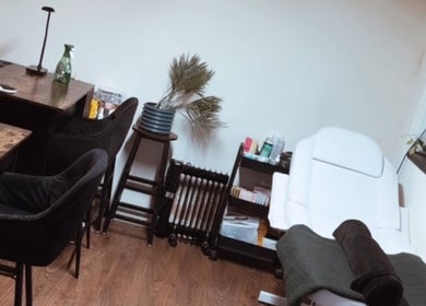 Elegant beauty treatment room at Lubello’s, Scunthorpe, England, GB with modern decor and plush seating.
