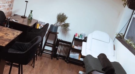 Elegant beauty treatment room at Lubello’s, Scunthorpe, England, GB with modern decor and plush seating.