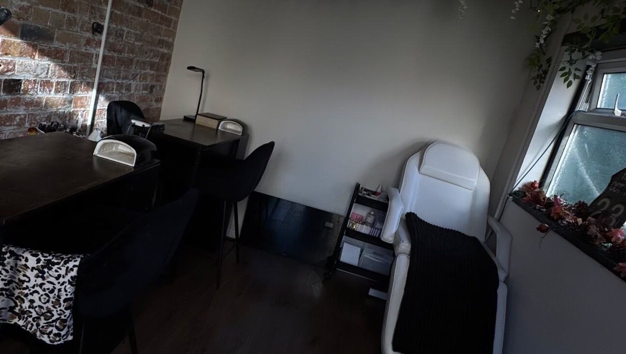 Inviting beauty treatment corner at Lubello’s, Scunthorpe, England, GB, with a massage chair and desks.