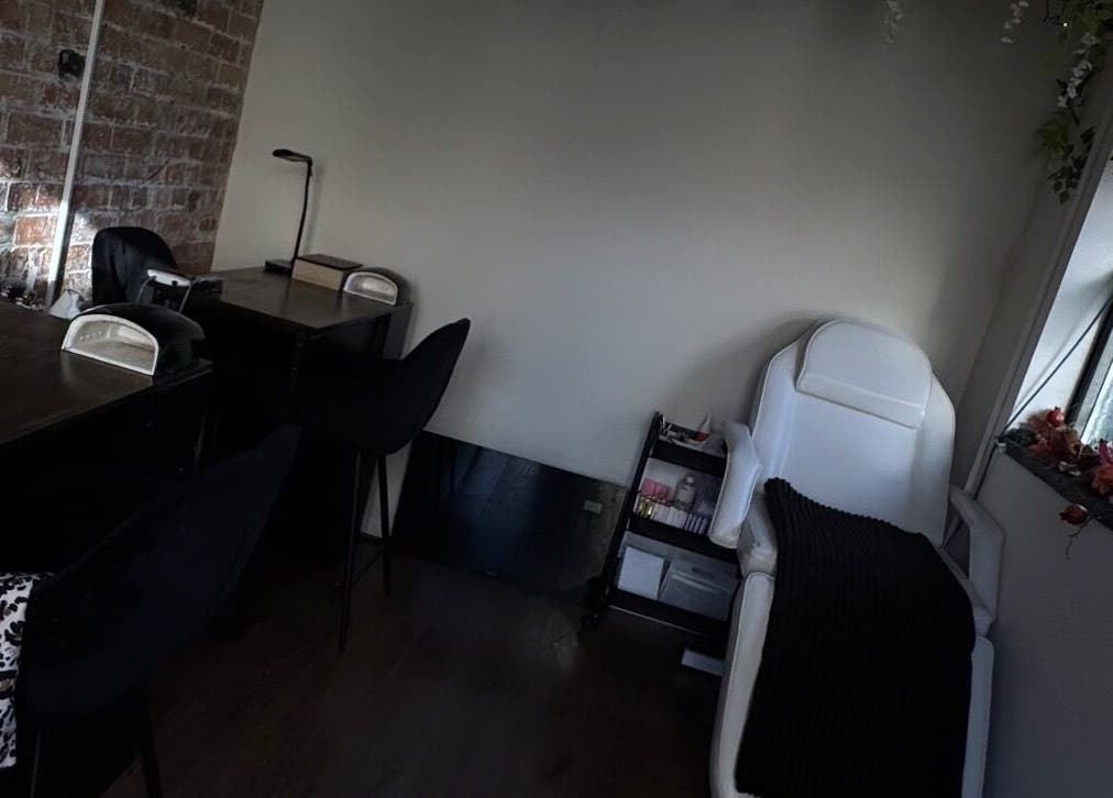 Inviting beauty treatment corner at Lubello’s, Scunthorpe, England, GB, with a massage chair and desks.