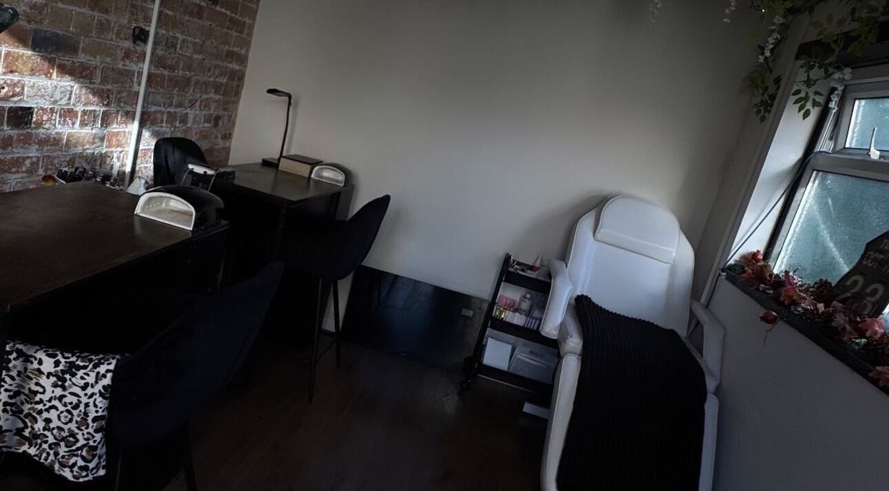 Inviting beauty treatment corner at Lubello’s, Scunthorpe, England, GB, with a massage chair and desks.