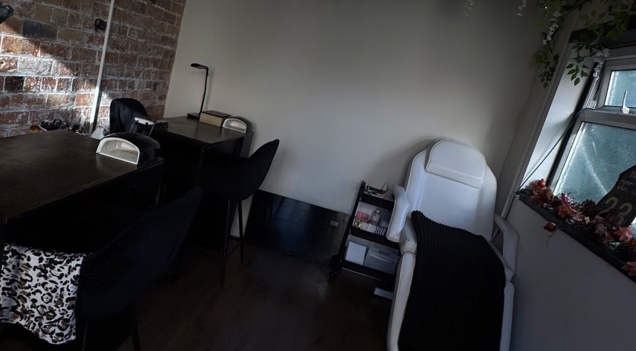 Inviting beauty treatment corner at Lubello’s, Scunthorpe, England, GB, with a massage chair and desks.