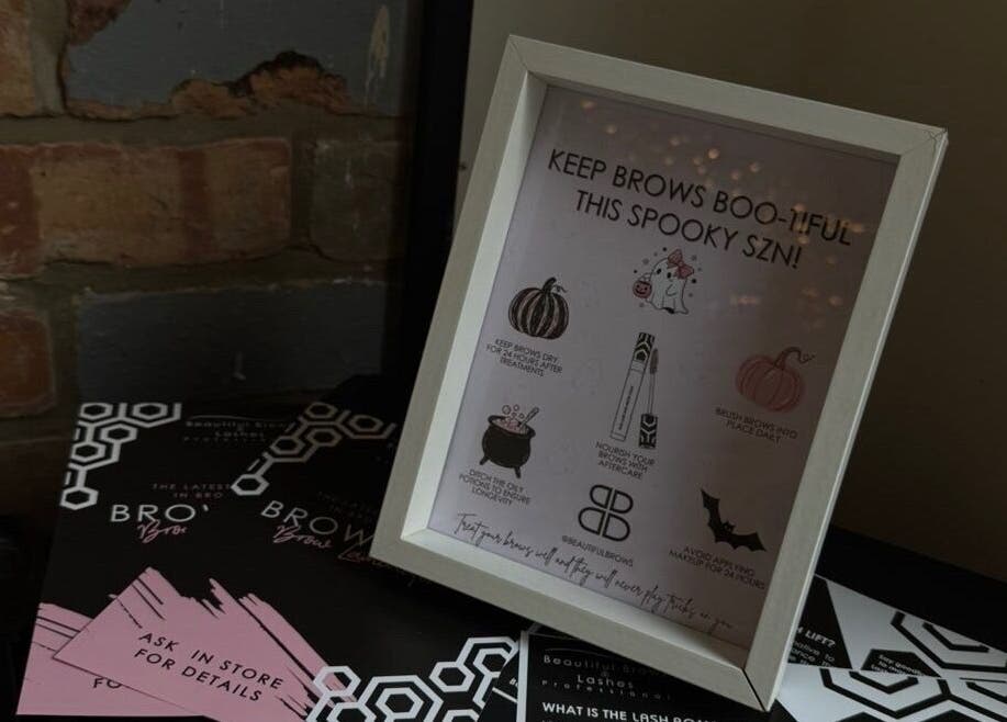 Decorative brow care tips frame at Lubello’s in Scunthorpe, England, GB against a rustic brick wall.