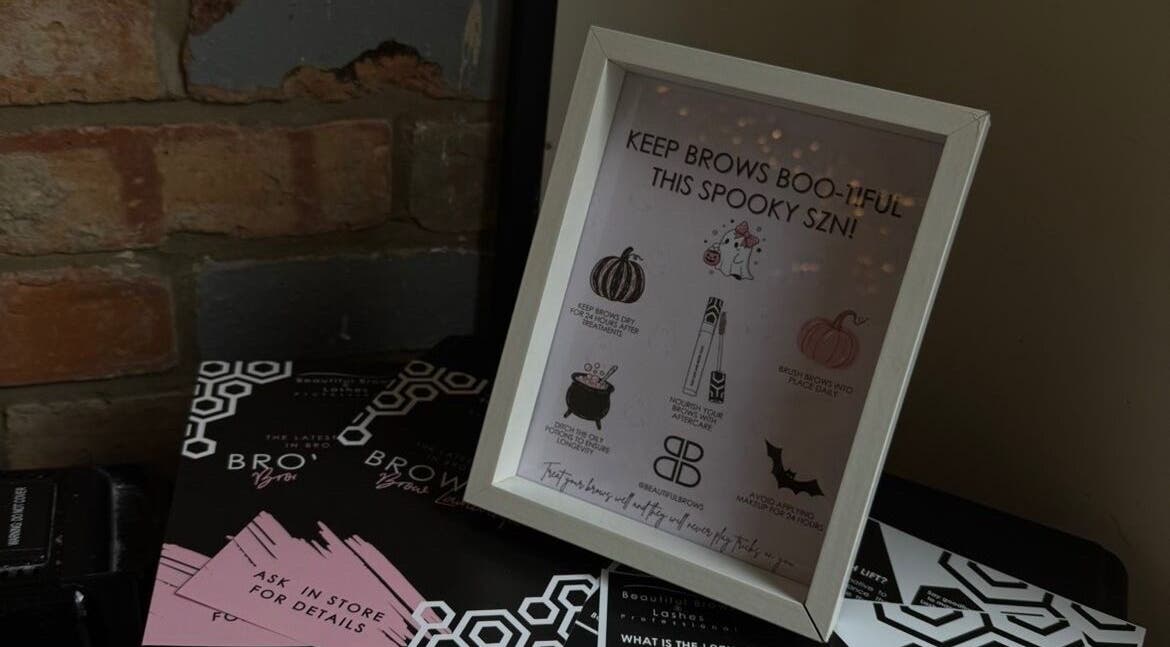 Decorative brow care tips frame at Lubello’s in Scunthorpe, England, GB against a rustic brick wall.