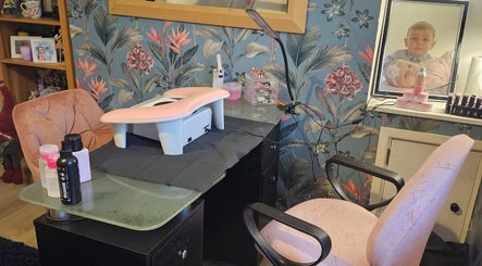 Stylish nail station at Kawaii Nails, Neath, Wales, GB with floral wallpaper and manicure tools.