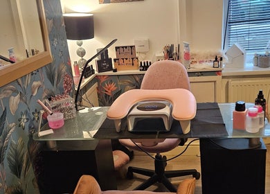 Elegant nail station at Kawaii Nails, Neath, Wales, GB, with floral wallpaper and manicure setup.